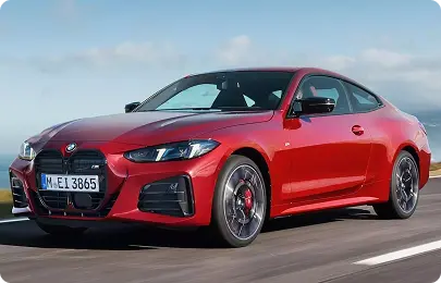 BMW Serie 4 de importación rojo circulando por carretera abierta